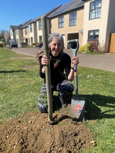 Ros Hathorn planting trees in Orchard Park